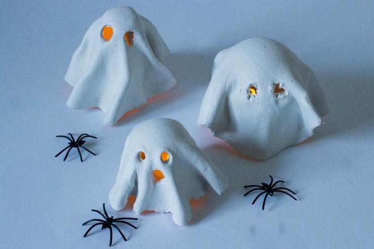 tealight clay ghosts
MumInTheMadHouse/Pinterest
Want a spooky nightlight the kids will adore? Grab some air-drying clay and battery-operated tealights to make these clay tealight ghosts that can watch over the mantle or make finding the bathroom at night a little easier. (If only it could help the boys aim...) 