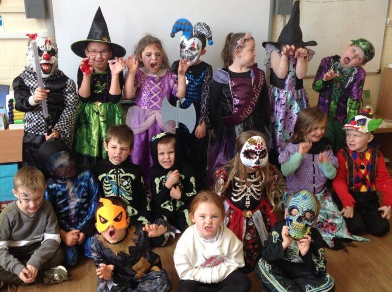 kids wearing halloween costumes
