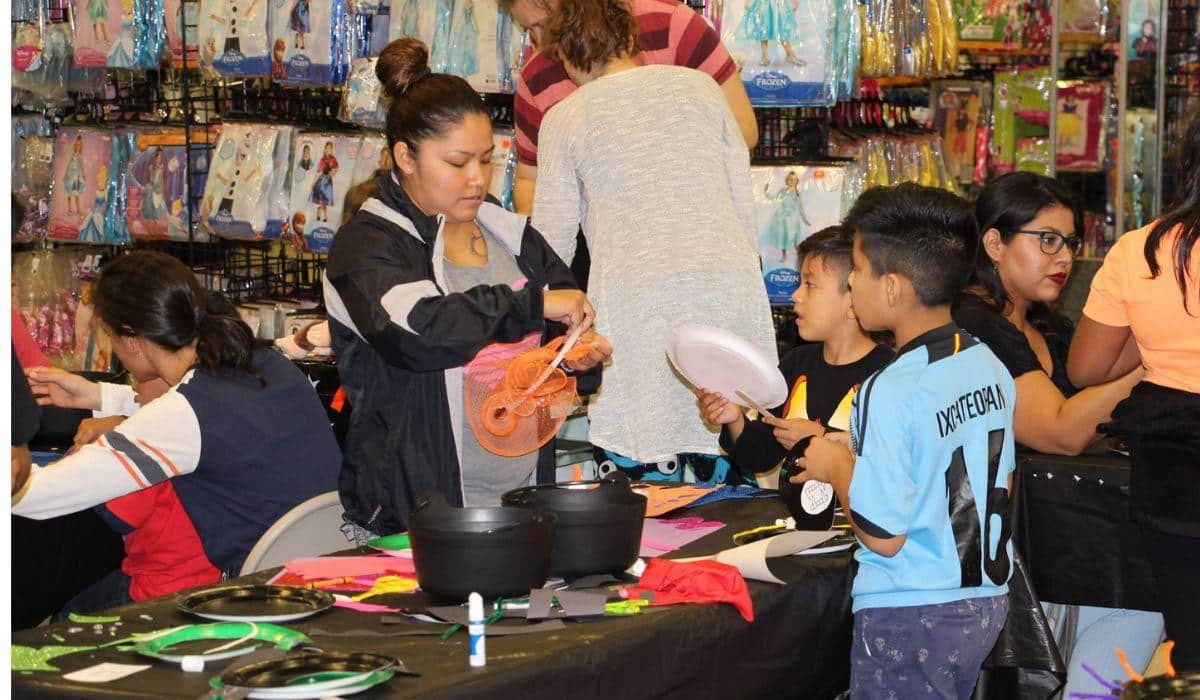 people creating Halloween crafts at a store